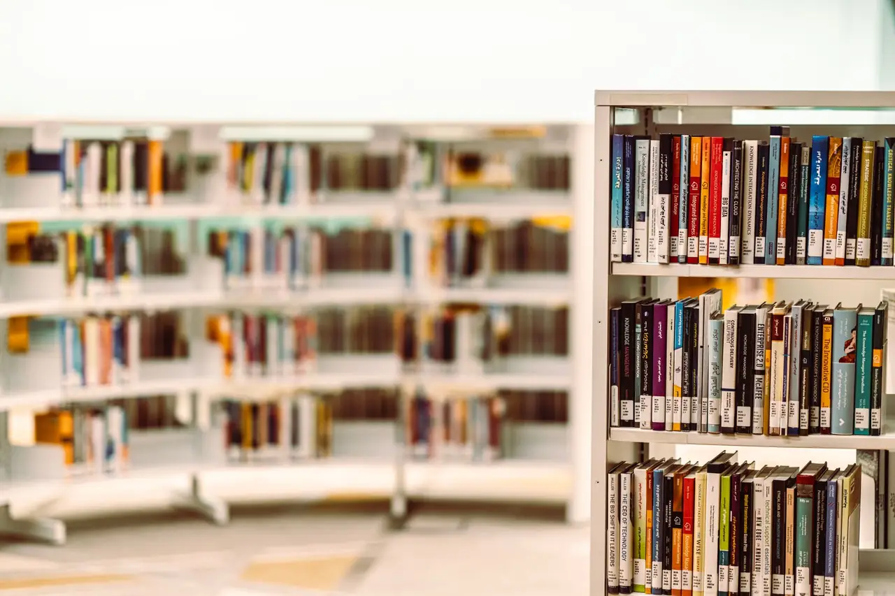Rows of books arranged on shelves in a library